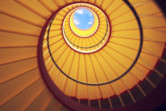 Low angle shot of a golden spiral staircase. (credit: Getty Images)