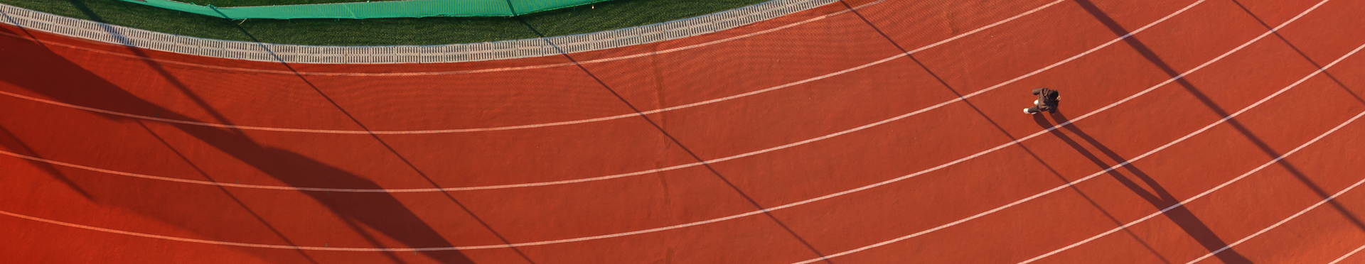 Aerial view of runner running along a track (source: Getty Images)