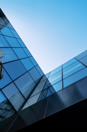 Low-angle view of the sky framed by a modern glass building (credit: Getty Images)